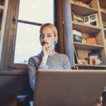 Beautiful,Woman,Is,Using,Her,Laptop,Computer,In,Front,Of