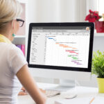 Woman,Using,Gantt,Chart,For,Project,Management